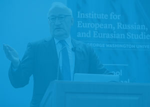 French Ambassador speaking at the Elliott School with a blue overlay