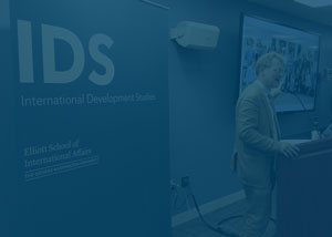 photo of Sean Roberts, IDS director, speaking at an IDS event with a blue overlay