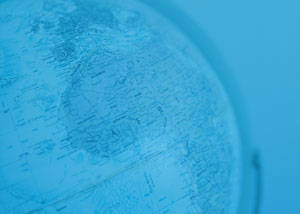 Photo of a globe with a blue overlay