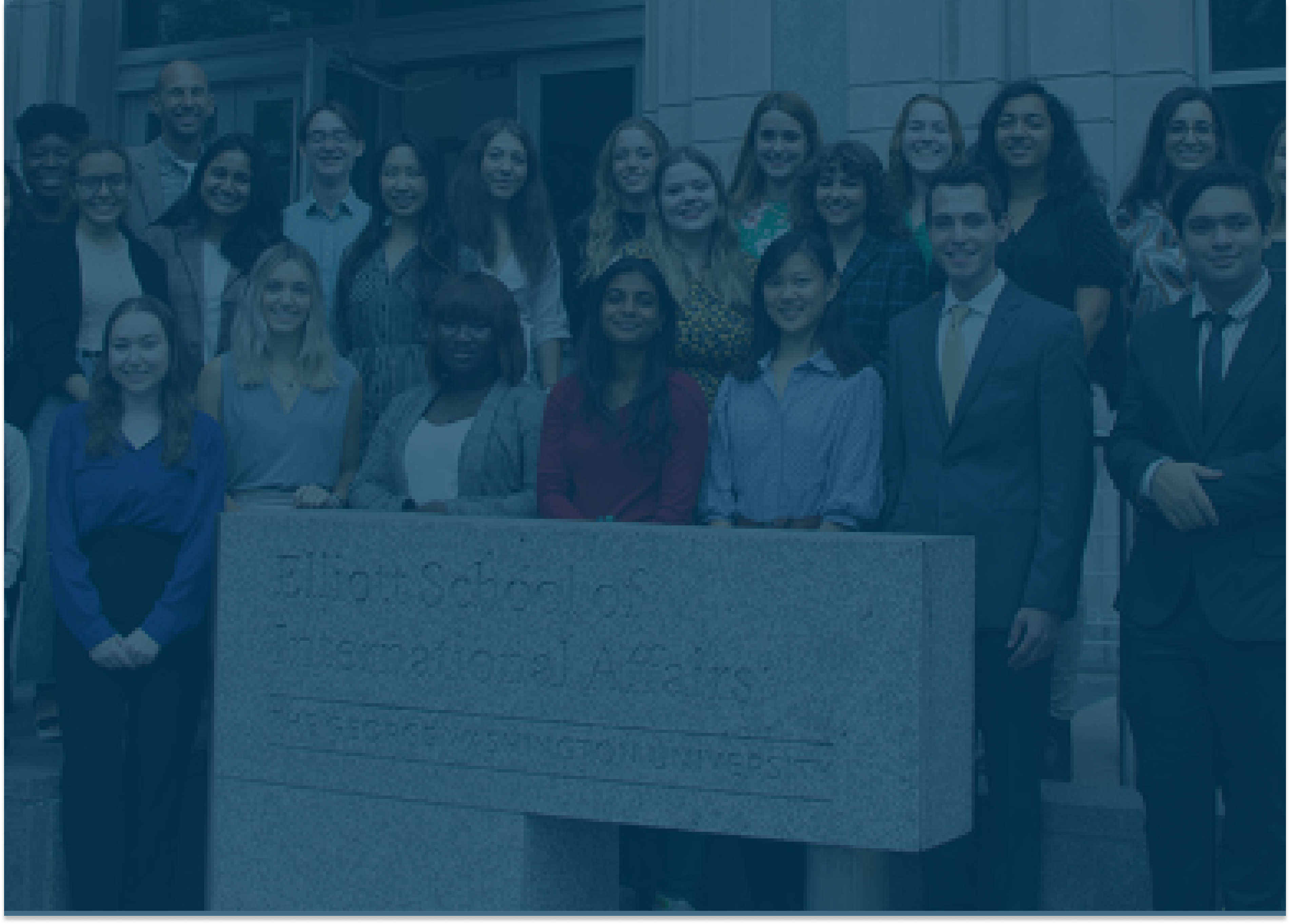 A group of students who completed the Deans Scholars Program standing in front of the Elliott School