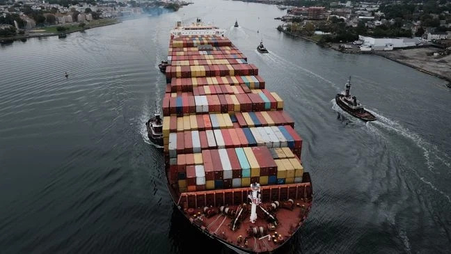  A cargo ship moves under the Bayonne Bridge as it heads into port on Oct. 13, 2021, in Bayonne, New Jersey. (Photo by Spencer Platt/Getty Images)