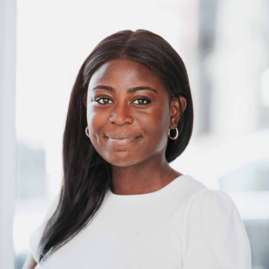 Onyinye Ijeh smiles, wearing a white blouse