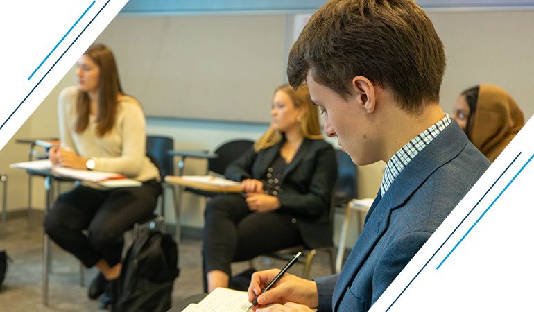 Graphic: Student taking notes during class