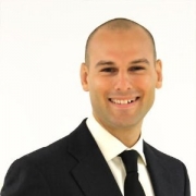 Photo: Headshot of Jeremy Case in a business suit in front of a white background
