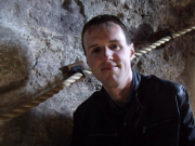 Photo: Daniel Perkins in front of a cave wall