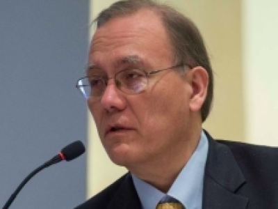 Scott Pace speaking at a podium