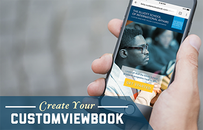 Text: "Create your customviewbook" with a photograph of of someone looking at a customviewbook on their cell phone