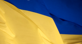 Partial image of a blue and yellow flag.
