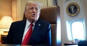 President Donald Trump speaks to reporters aboard Air Force One on Sunday, Feb. 9, 2025. (AP Photo/Ben Curtis)