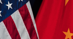 Partial photo of the American flag (left) and the Chinese flag (right)