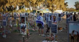 People visit the site of the Nova music festival, where hundreds of revelers were killed and abducted by Hamas and taken into Gaza, as Israel marks the second year anniversary of the attack, near Kibbutz Reim, southern Israel, Tuesday, Oct. 7, 2025. 
